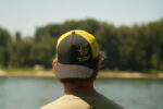black cat black and yellow trucker cap