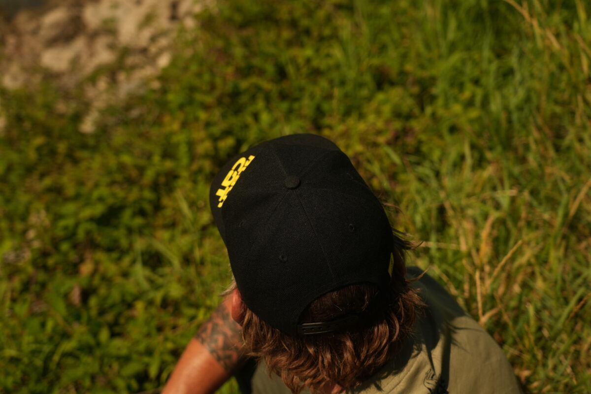 black cat black flat peak cap